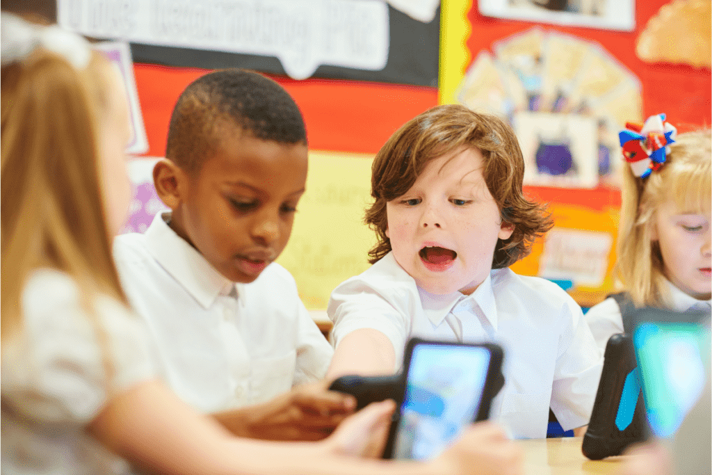 a group of children use an app as part of classroom learning